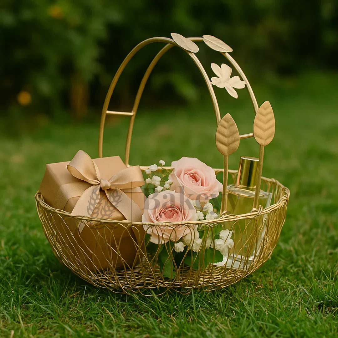 Gold wire hamper basket with pink roses, a gift box, and perfume, Bakeyy gifting supplies