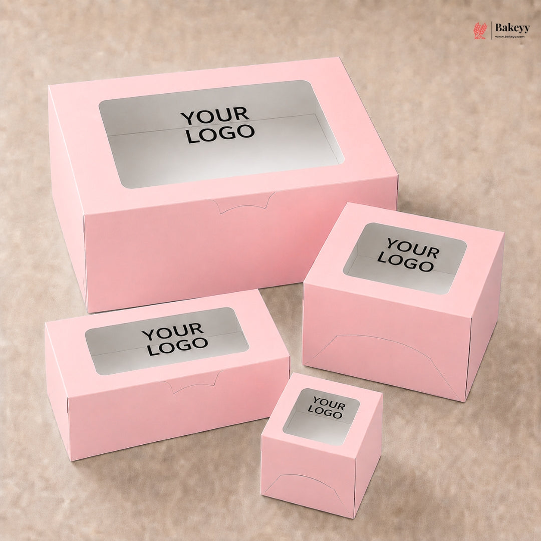 Set of pink boxes with windowed top and 'YOUR LOGO' label on a beige background