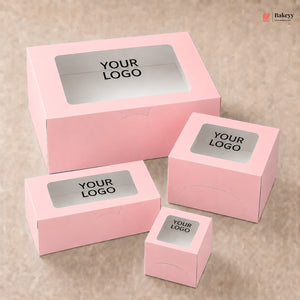 Set of pink boxes with windowed top and 'YOUR LOGO' label on a beige background