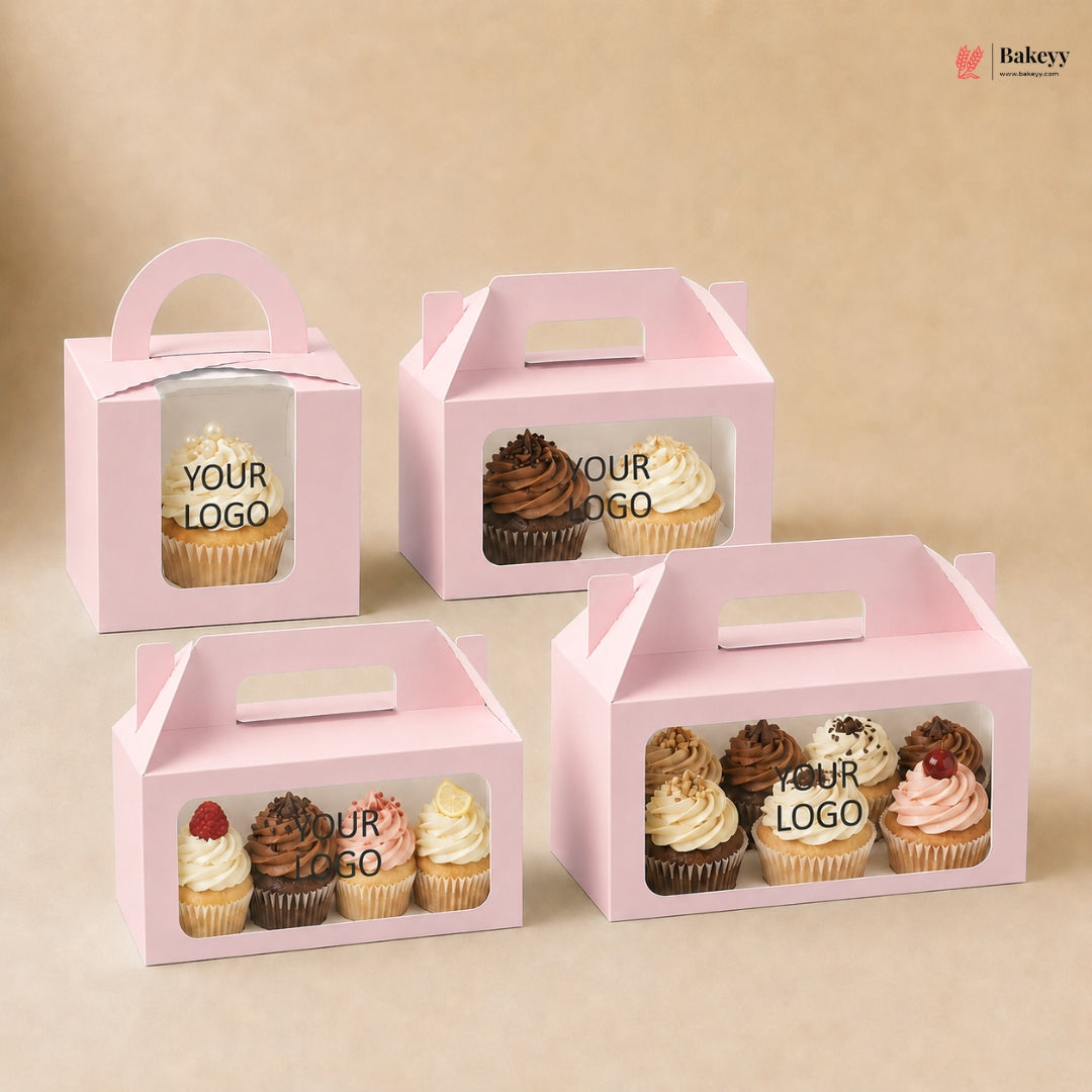 Pink cupcake boxes with window on a beige background, featuring various cupcakes and 'Your Logo' text.