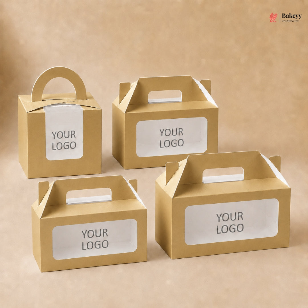 Four gold cardboard boxes with clear window panels and 'YOUR LOGO' text on a beige background.