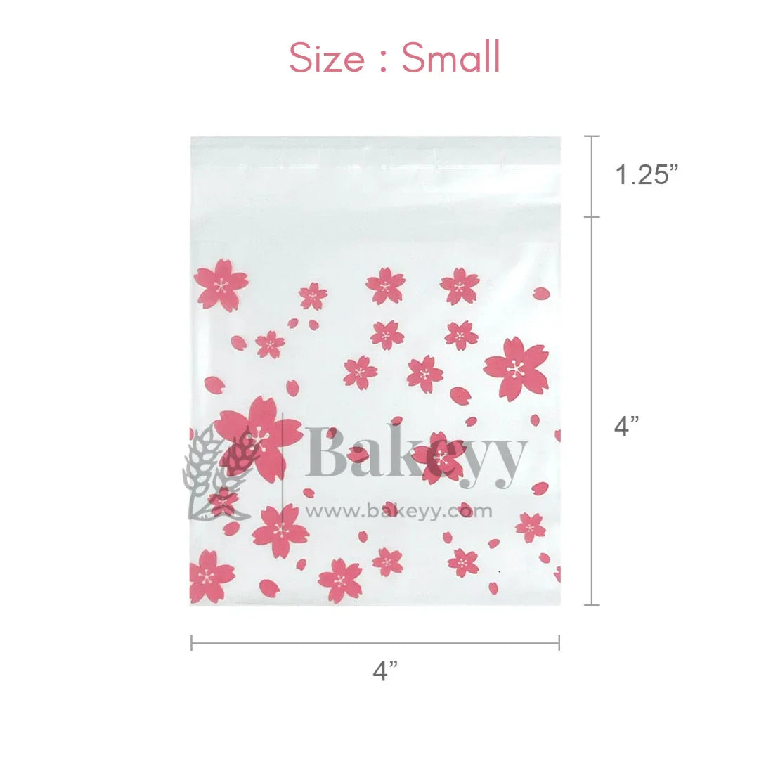 Small clear plastic bag with pink floral designs and 'bakeyy' branding, showing dimensions.