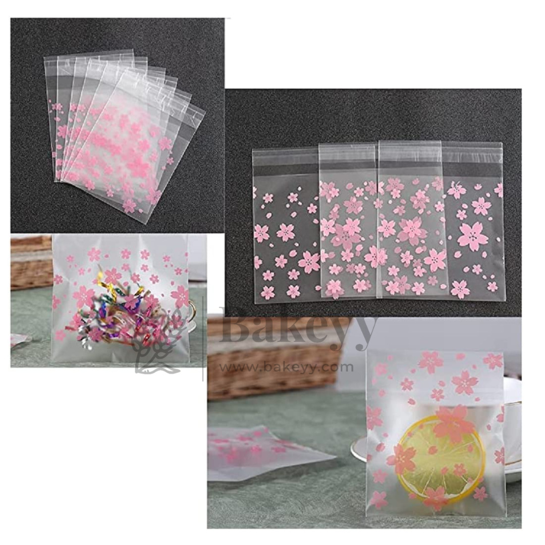 Clear cellophane bags with pink floral designs on a white background