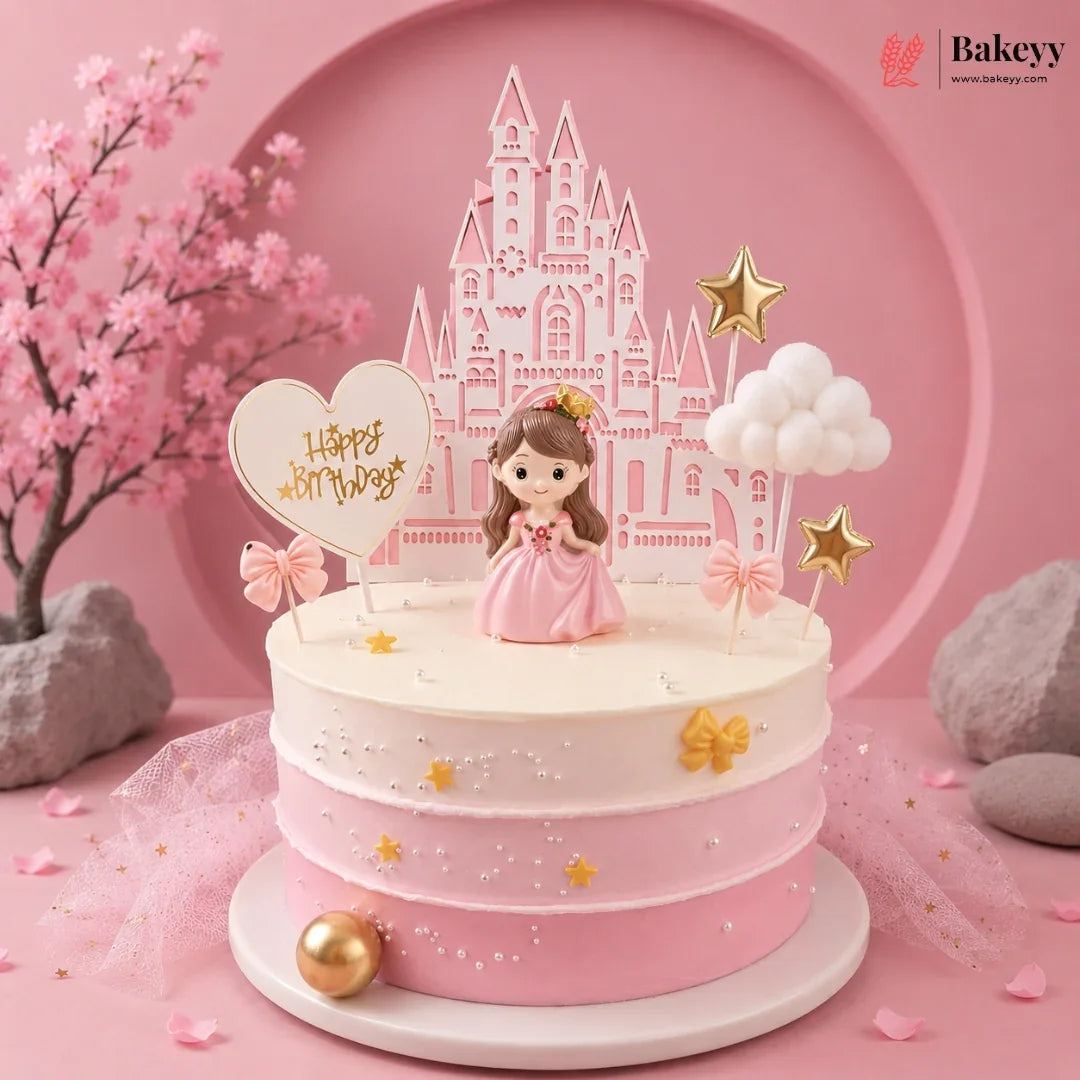 Pink and white cake with princess figurine and castle topper on a pink background