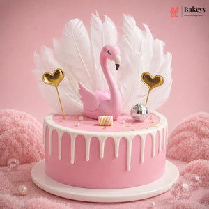 Pink cake with flamingo decoration on a pink background