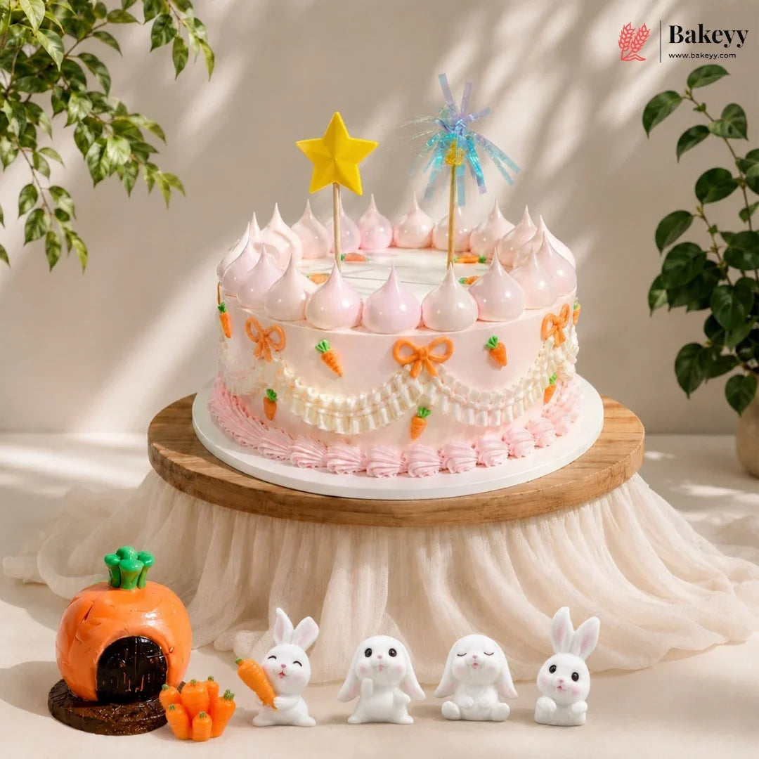 Decorative cake with rabbit figurines and a pumpkin house on a neutral background