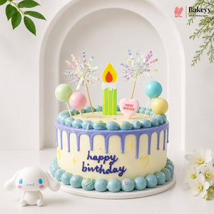 Colorful birthday cake with candles and decorations on a white background, featuring the Bakeyv brand.