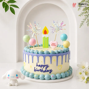 Colorful birthday cake with candles and decorations on a white background, featuring the Bakeyv brand.