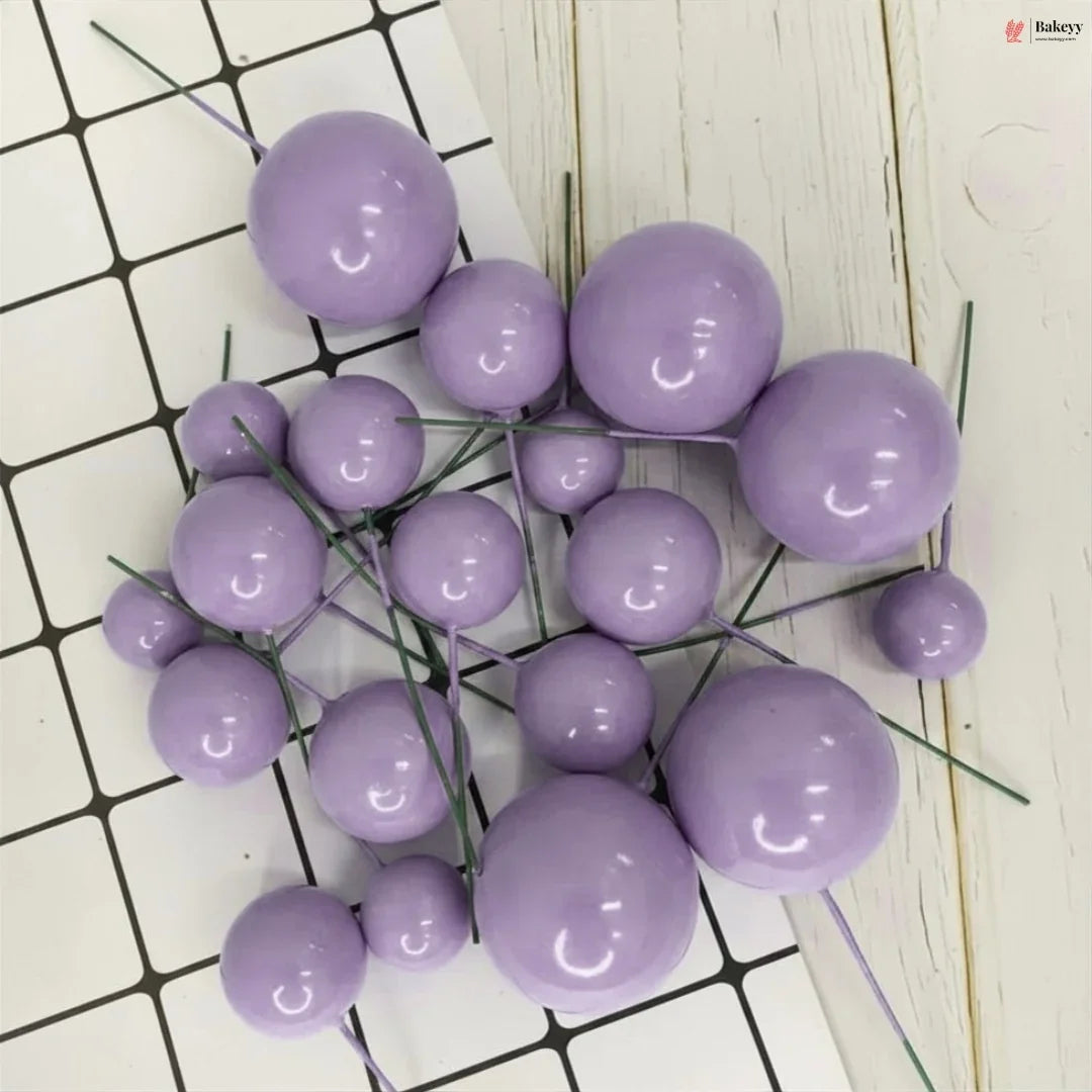 Purple spherical decorations on a white and black grid background