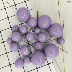 Purple spherical decorations on a white and black grid background