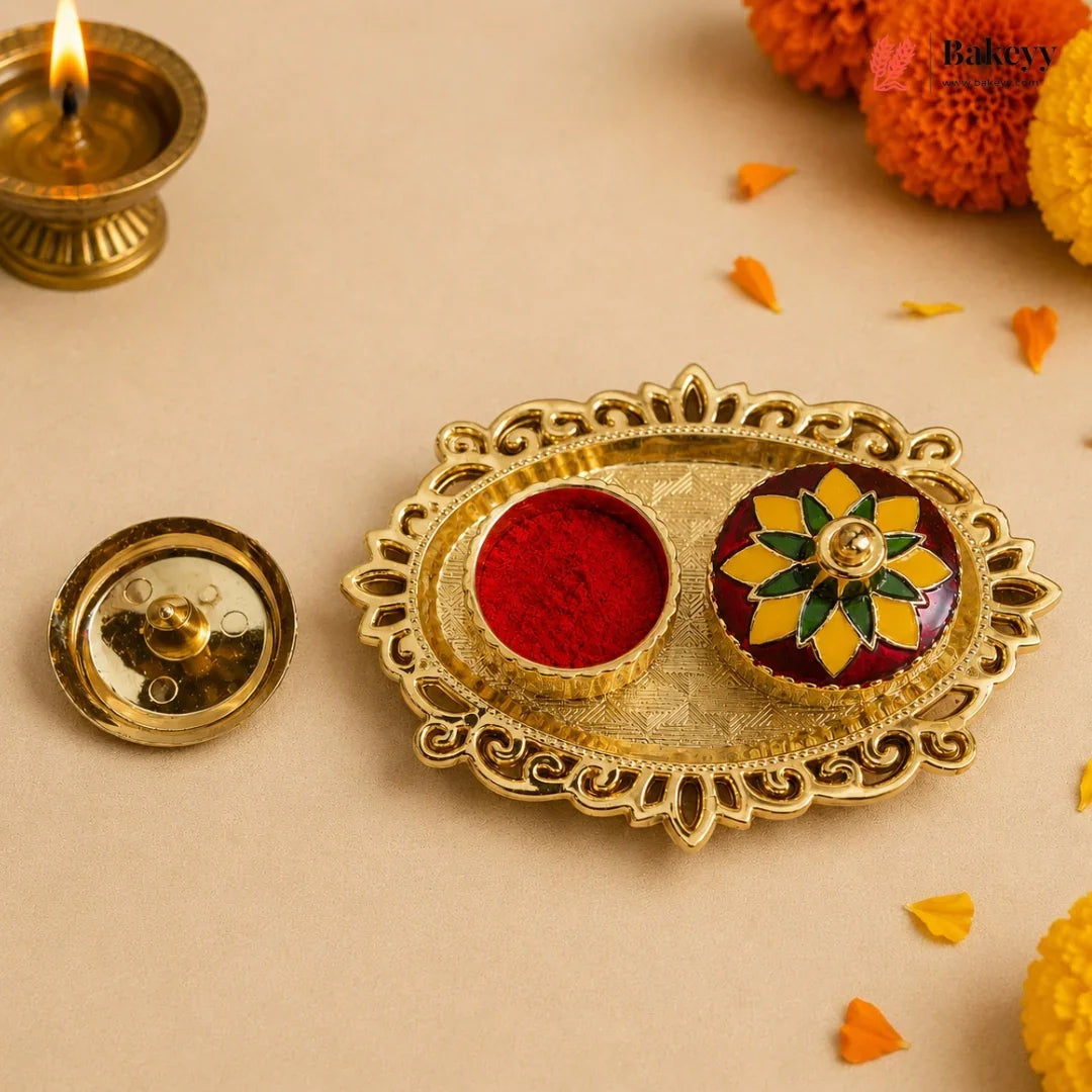 Decorative gold tray with red and multicolored powder, surrounded by Diwali decorations on a beige background.