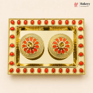 Decorative gold tray with red stones on a beige background, featuring the Bakeyy brand.