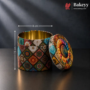 A round metal tin container with a colorful geometric and floral mandala pattern, shown open with its lid leaning against it. White dimension lines indicate a height of 7.