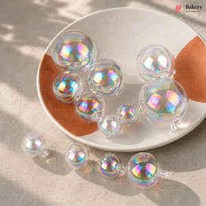Iridescent bubble-like objects on a white plate with a beige background