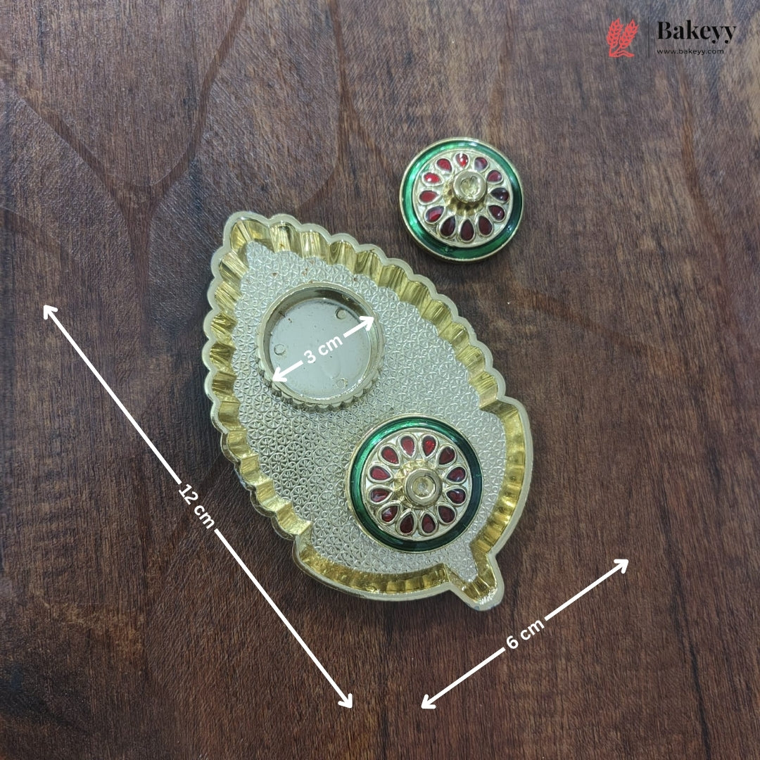 Decorative metal item with measurements on a wooden surface, featuring the brand 'Bakeyy'.