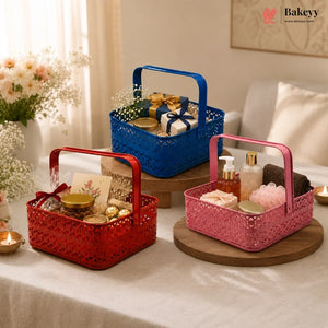 Three decorative baskets in red, blue, and pink on a table with various items.