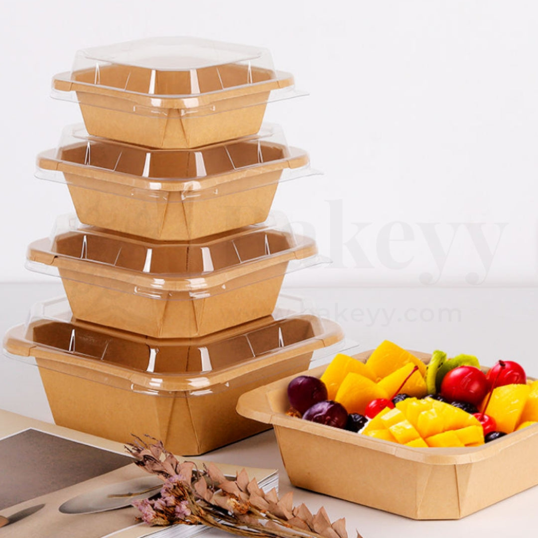 Set of wooden food containers with a smaller container filled with fruits on a light background