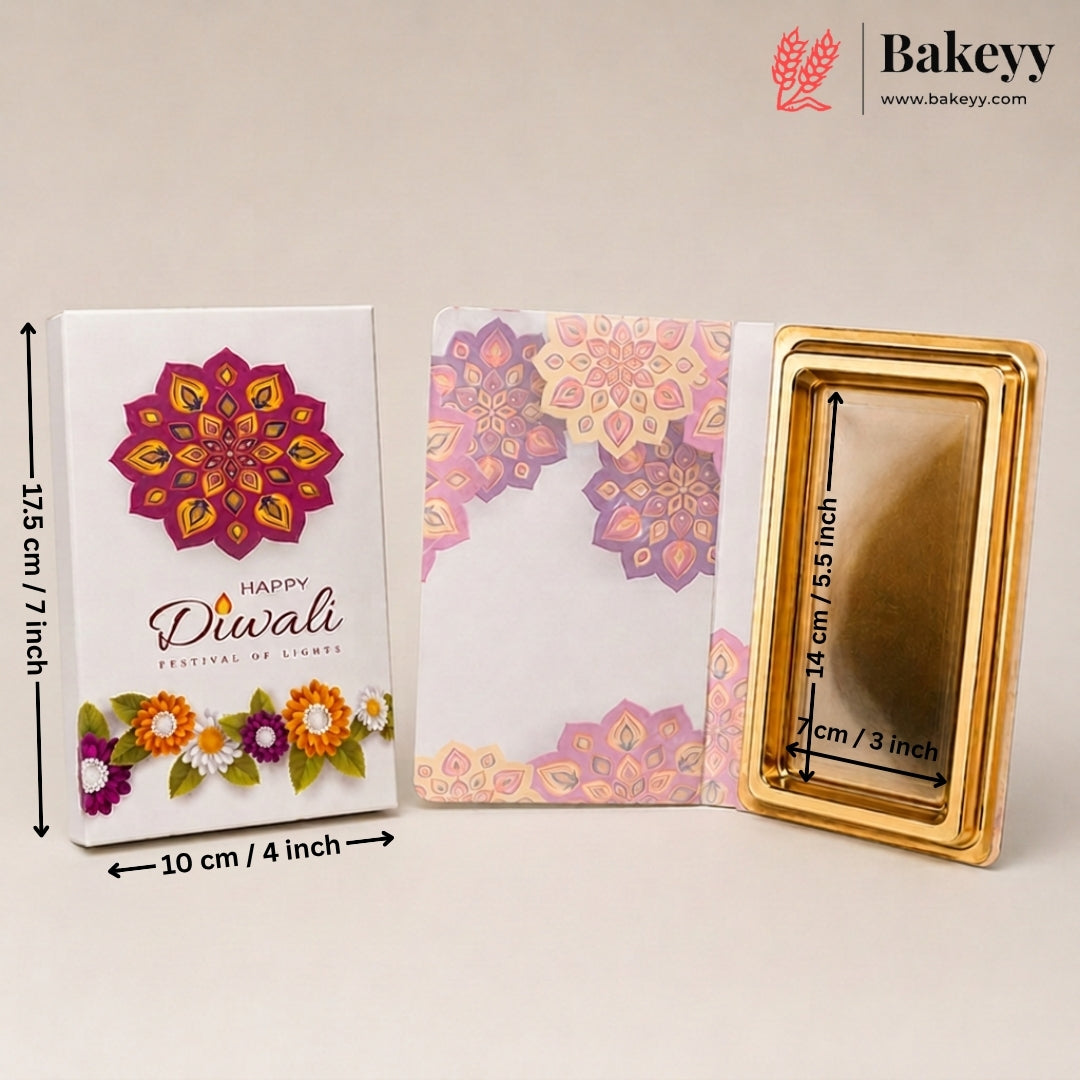 Gold rectangular Diwali candle with a white printed box and a pink floral envelope, shown with dimension markings on a light beige background. The Bakeey brand logo is visible in the top right.