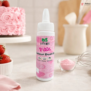 Bottle of pink food color with a cake and strawberries in the background