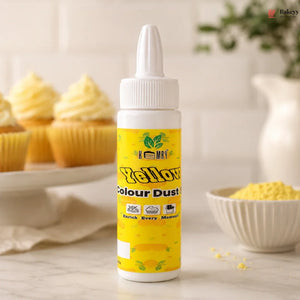 Bottle of yellow food color with cupcakes in the background