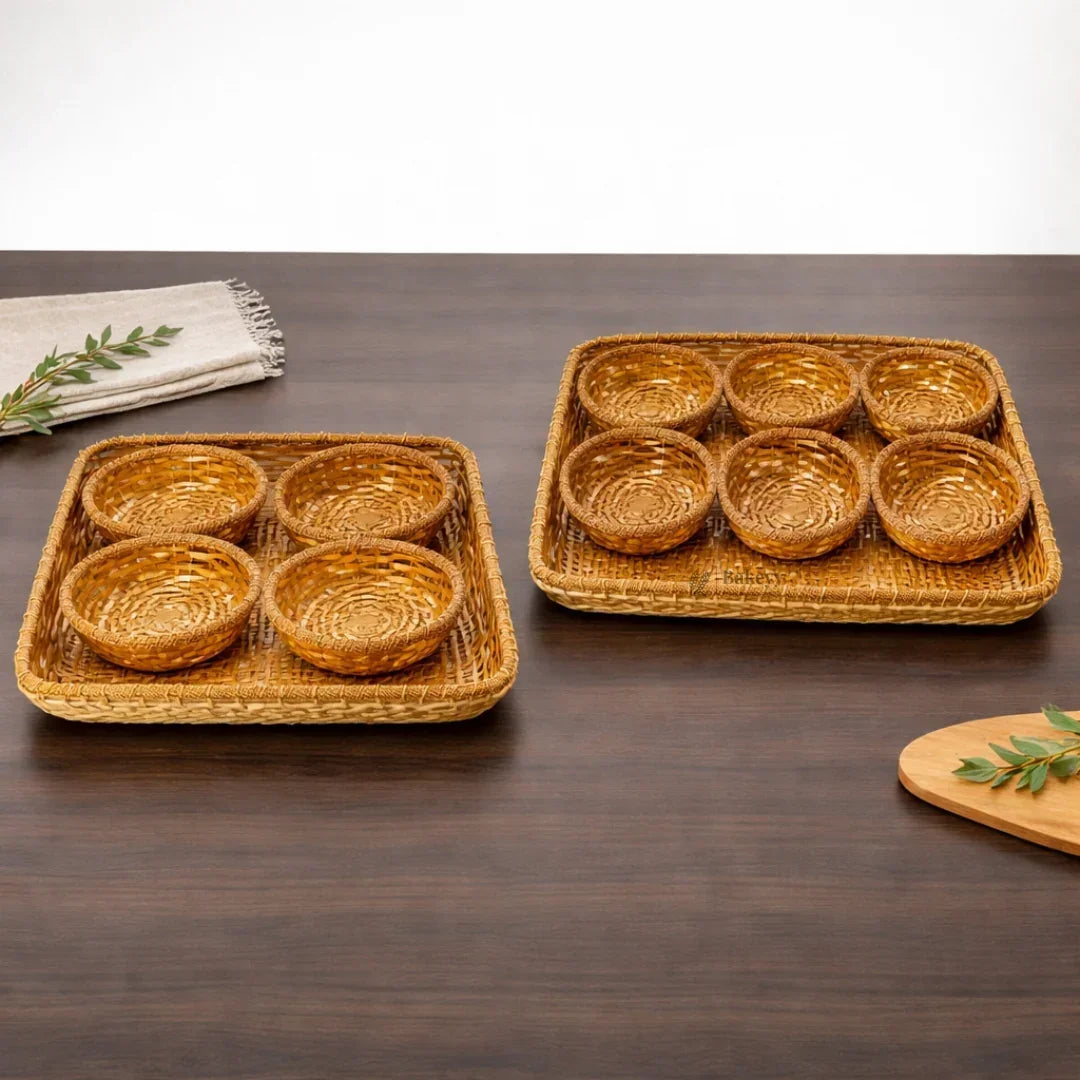 Two square wicker dry fruit trays with round compartments on a wooden table, Bakeyy gift packaging