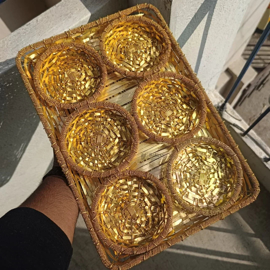 Golden woven dry fruits tray with six round compartments for gift packaging from Bakeyy
