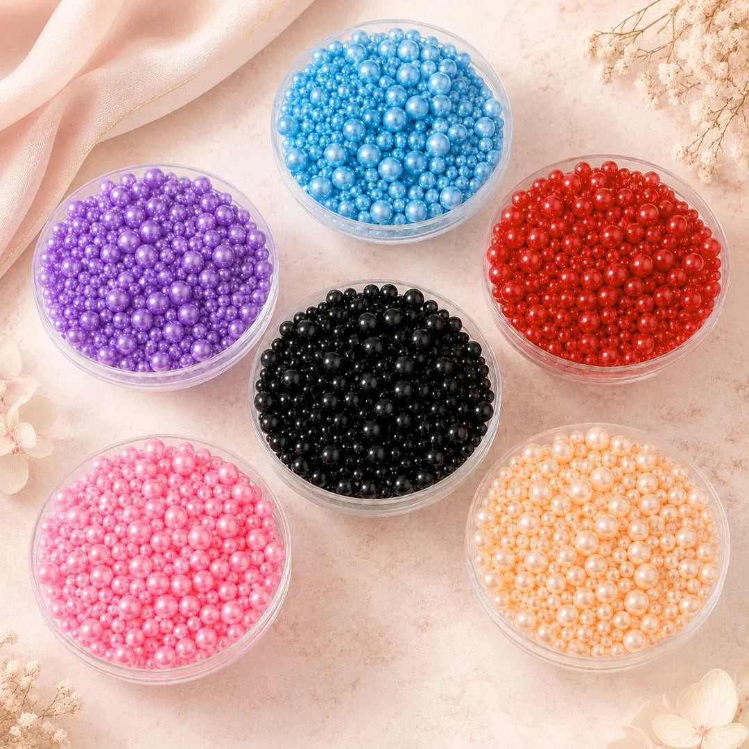 Assorted colored beads in transparent containers on a light background