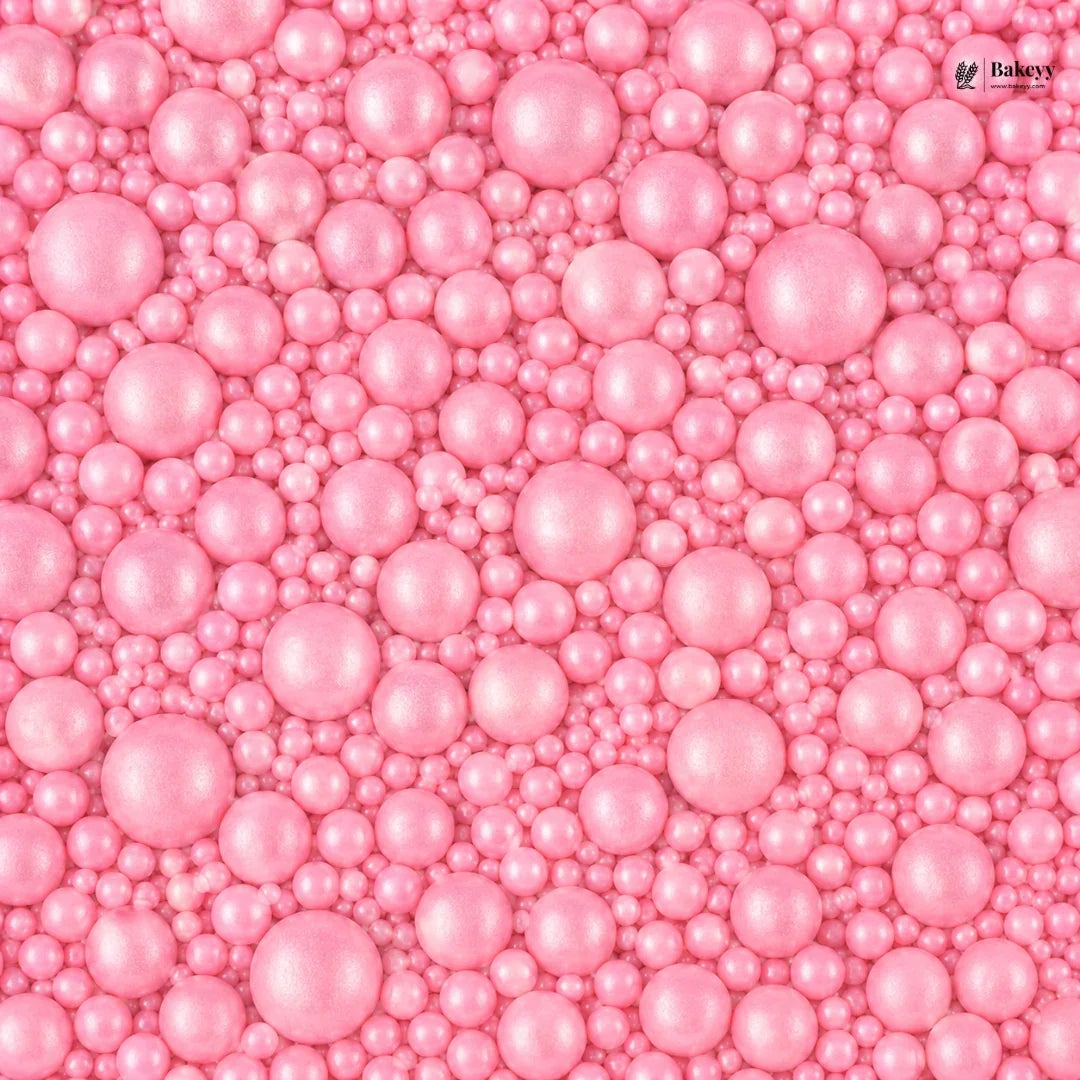 Pink pearl-like beads with a visible brand logo in the corner.