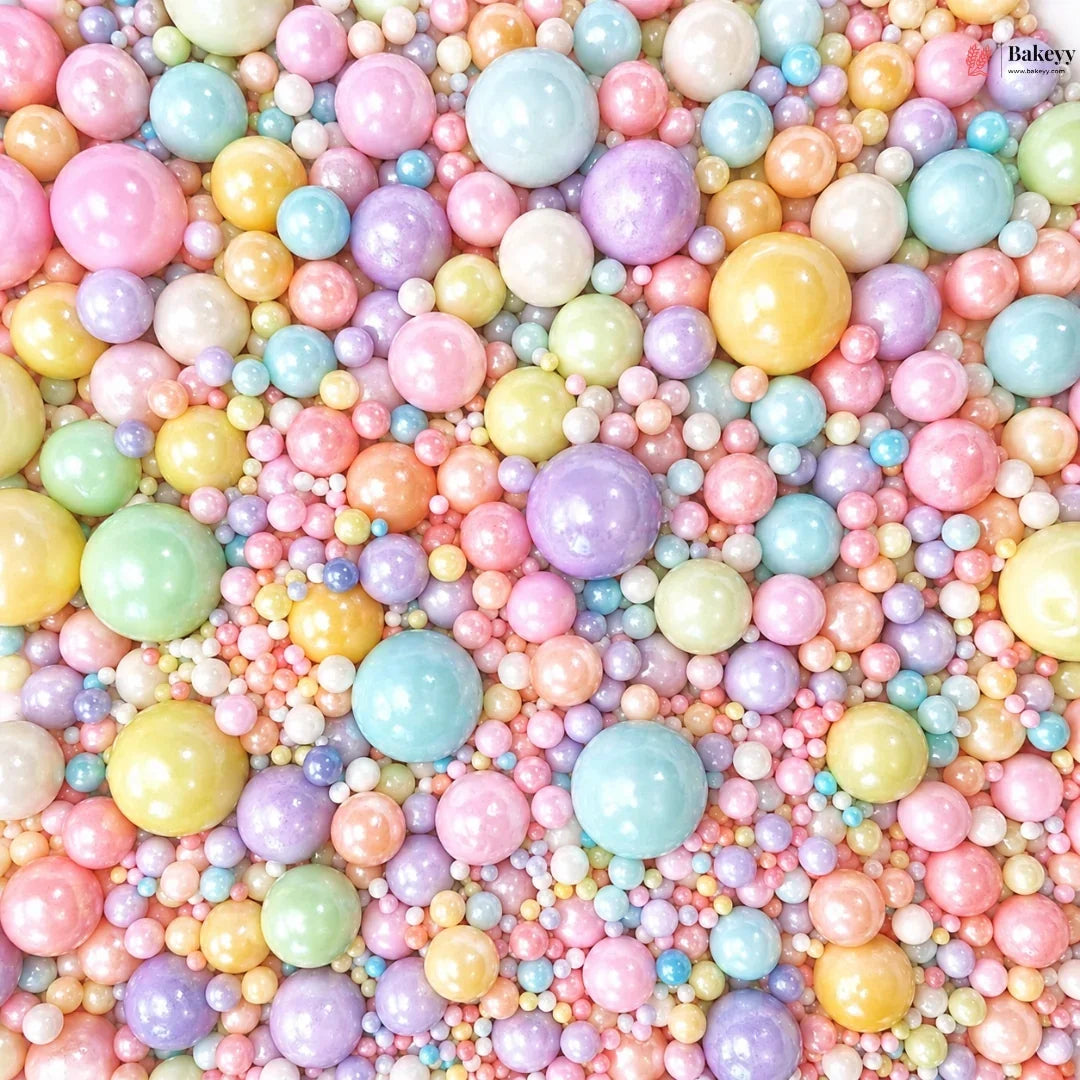 Pastel-colored round beads in various shades on a pink background