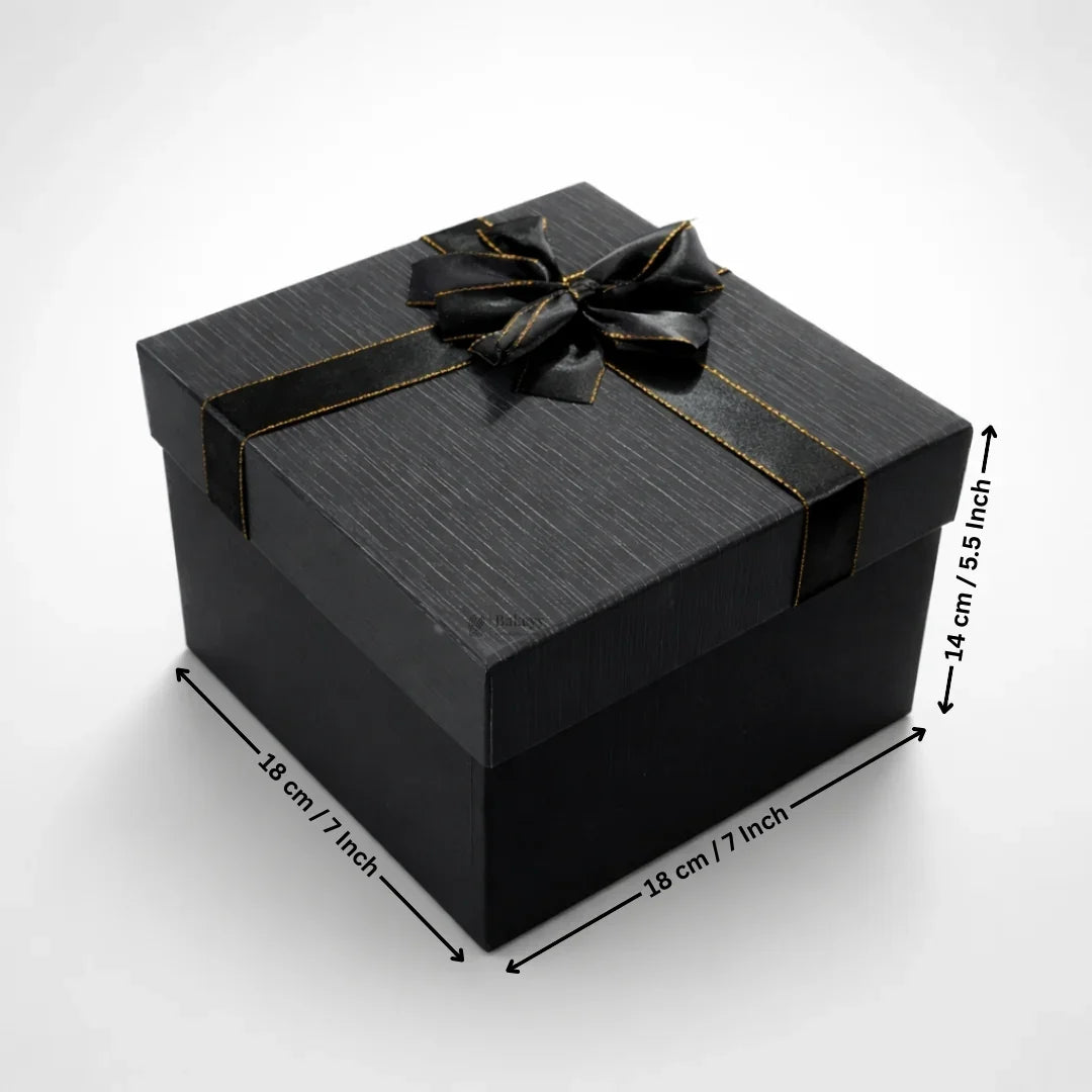 Elegant black gift box with gold-trimmed ribbon, ideal for bakery and gift packaging