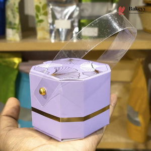 Purple jewelry box with gold accents held by a hand, with 'Bakeyy' branding in the background.