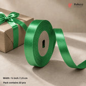 A roll of shiny green satin ribbon with a matching ribbon bow on a brown kraft paper gift box, shown on a beige background with text indicating width and pack size.