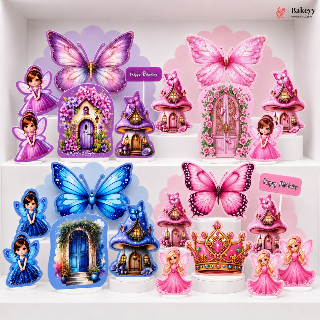 A collection of colorful fairy-themed party decorations displayed on white shelves, including pink and blue butterflies, fairy figures, miniature houses, and a crown, with 'Happy Birthday' signs.