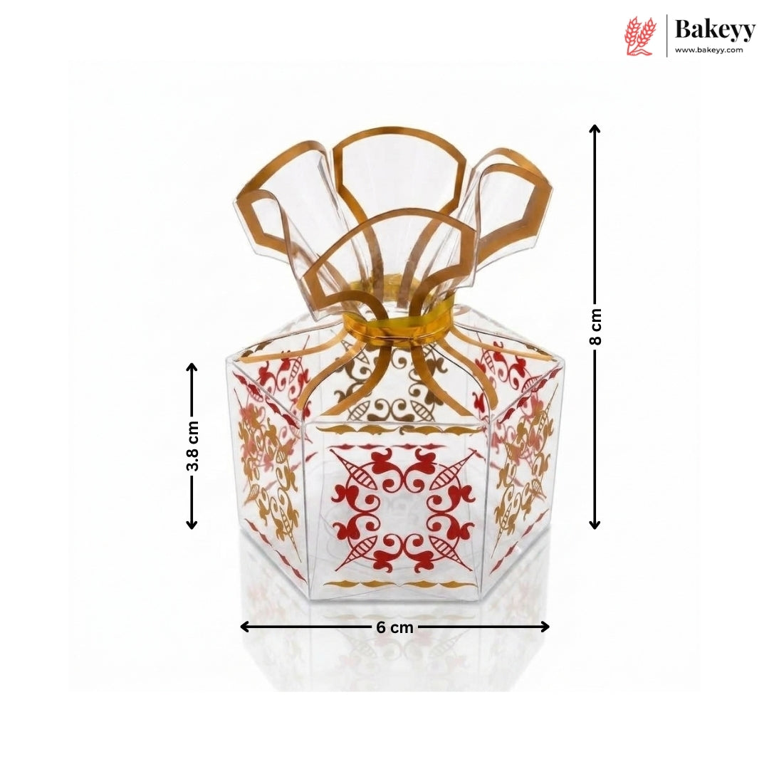 Decorative glass container with gold and red patterns, shown with dimensions on a white background.