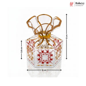 Decorative glass container with gold and red patterns, shown with dimensions on a white background.