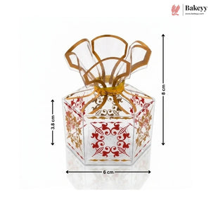 Decorative glass container with gold and red patterns, shown with dimensions on a white background.