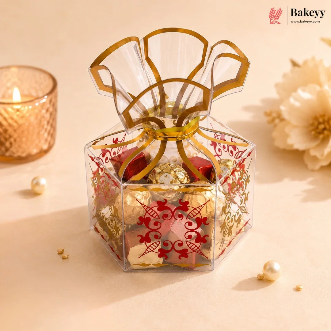 Decorative gift box with gold ribbon on a beige background, featuring Bakeyy branding.