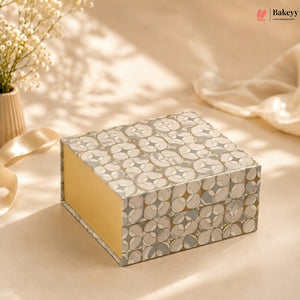 Decorative box with floral pattern on a soft background, featuring the brand 'Bakeyy'.
