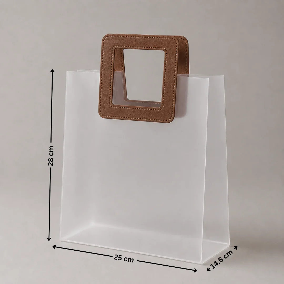 Clear plastic bag with a brown handle and measurements on a gray background