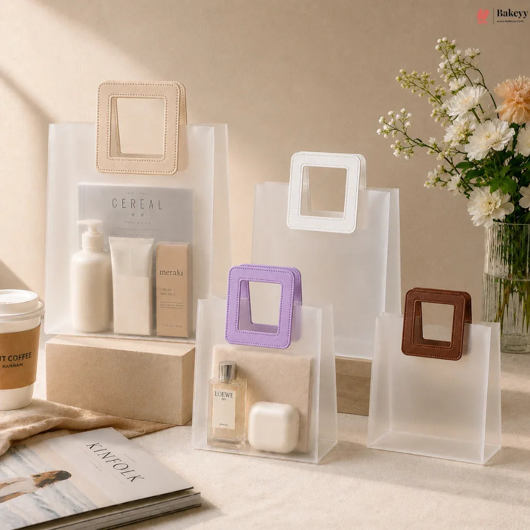 Clear acrylic display stands with square cutouts on a neutral background, featuring a coffee cup, magazine, and decorative items.