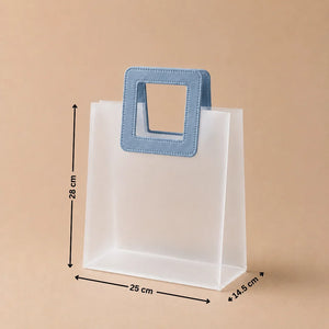 White paper bag with a blue handle and measurements on a beige background