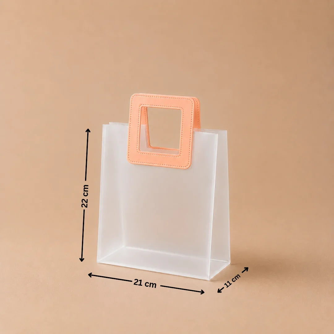 Clear plastic bag with a peach-colored handle and measurements on a beige background