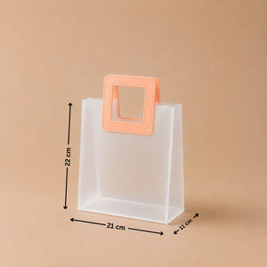Clear plastic bag with a peach-colored handle and measurements on a beige background