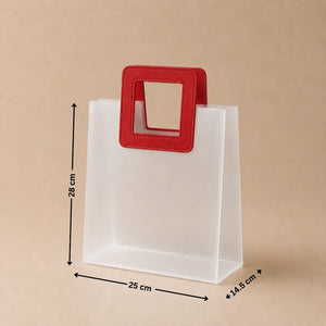 White paper bag with a red handle and measurements on a beige background