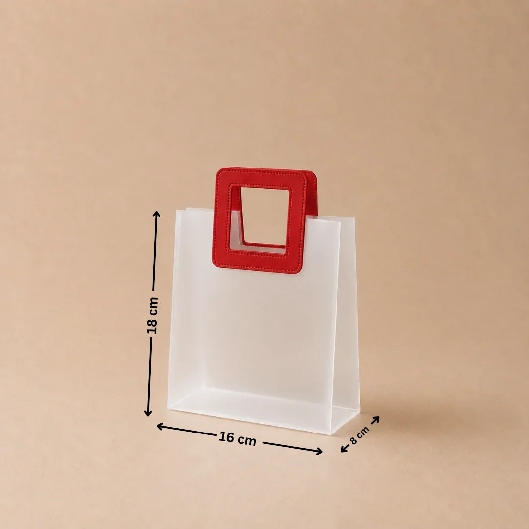 White paper bag with a red handle and measurements on a beige background