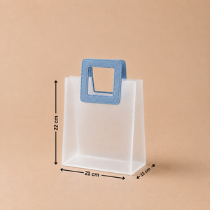 White paper bag with a blue handle and measurements on a beige background