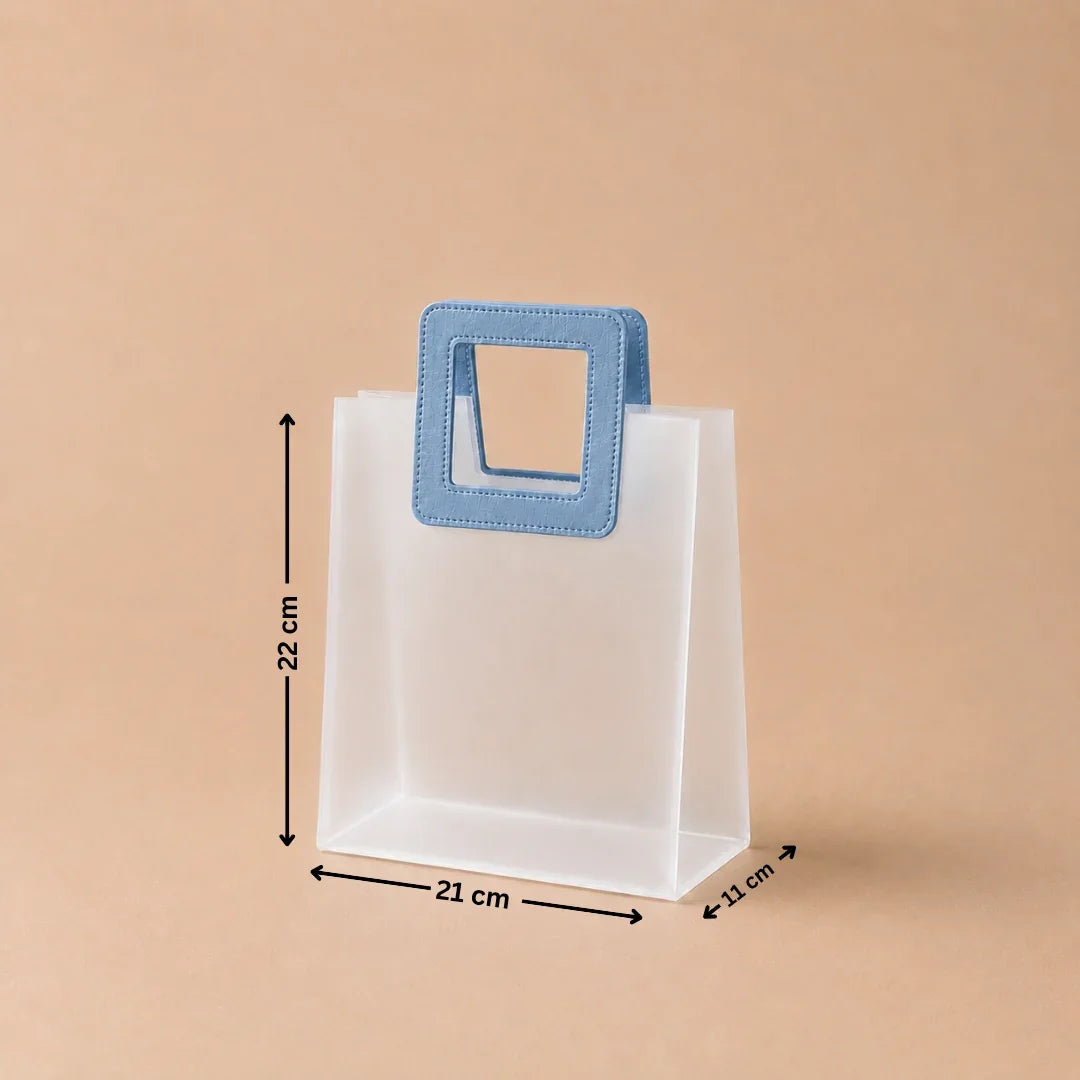 White paper bag with a blue handle and measurements on a beige background