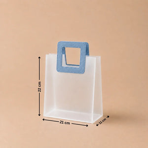 White paper bag with a blue handle and measurements on a beige background