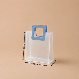 Clear plastic bag with blue handle and dimensions on a beige background