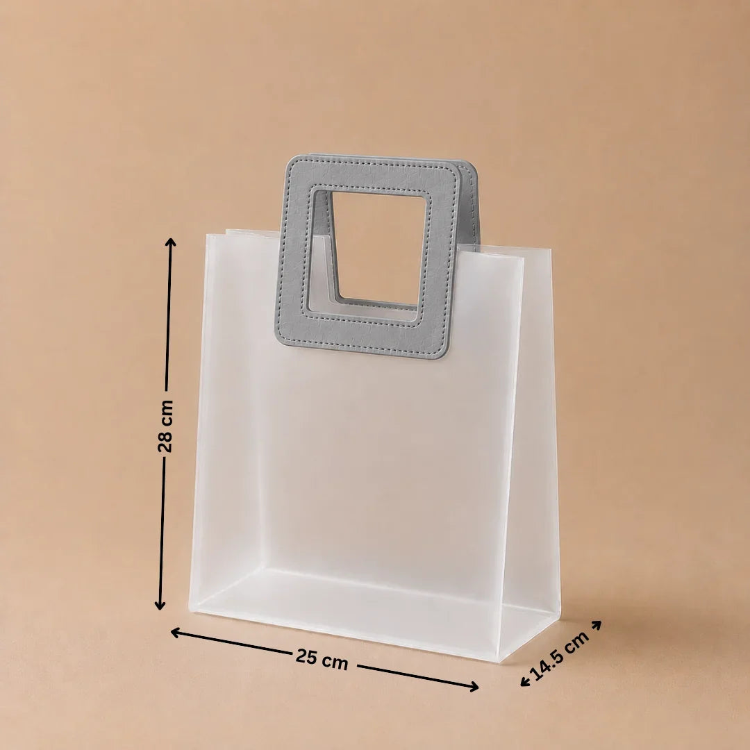White paper bag with gray handles and measurements on a beige background